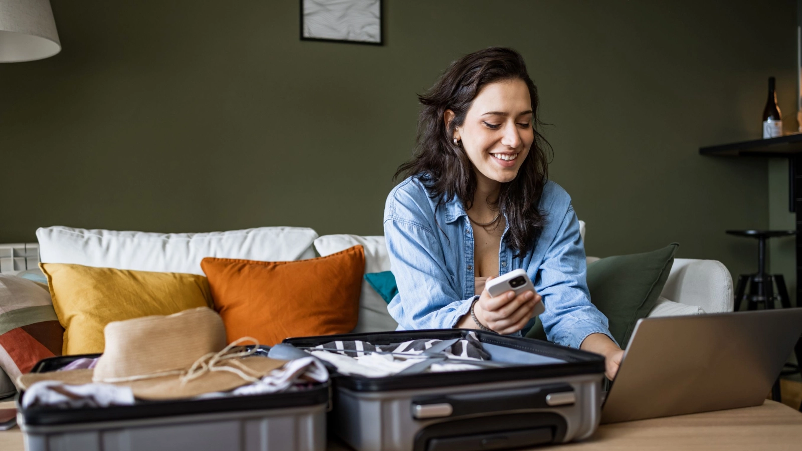 Woman using laptop to book travel insurance